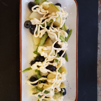 Amicis - Potato salad with olives, asparagus slices, and mayonnaise. - Mediterranean Near Me - Madrid, M Amicis - Potato salad with olives, asparagus slices, and mayonnaise. - Mediterranean Near Me - Madrid, M