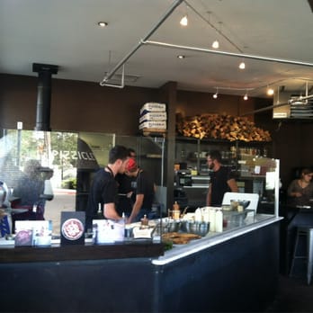 Pizzicletta - Guys working the pizza oven - Pizza Near Me - Flagstaff, Arizona