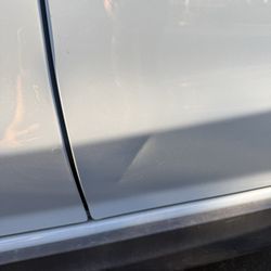 Evans Tire & Service Centers - Dented car door