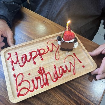 Gina's Kitchen +Catering - Chocolate cheesecake birthday slice - Breakfast & Brunch Near Me - Rancho Cucamonga, California Gina's Kitchen +Catering - Chocolate cheesecake birthday slice - Breakfast & Brunch Near Me - Rancho Cucamonga, California