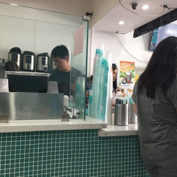 T4 - See that leaning tower of "new" cups? Yep, that's the stack that fell to the floor before being placed back on the counter! Ew! - Bubble Tea Near Me - Millbrae, California