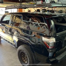 Assembled roof rack being installed Assembled roof rack being installed