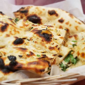 Antique Indian Delight - a basket of naan bread - Indian Near Me - Milwaukee, Wisconsin Antique Indian Delight - a basket of naan bread - Indian Near Me - Milwaukee, Wisconsin