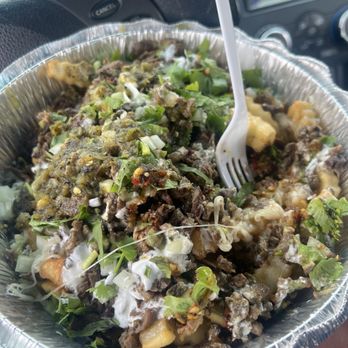 Taqueria Mora - Carne Asada Fries with salsa poured on top - Mexican Near Me - Chino Hills, California Taqueria Mora - Carne Asada Fries with salsa poured on top - Mexican Near Me - Chino Hills, California