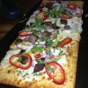 Topgolf - Chargrilled Steak ($9): roasted corn, steak, red grilled onion, chimichurri, red Fresno - Golf Near Me - Houston, Texas Topgolf - Chargrilled Steak ($9): roasted corn, steak, red grilled onion, chimichurri, red Fresno - Golf Near Me - Houston, Texas