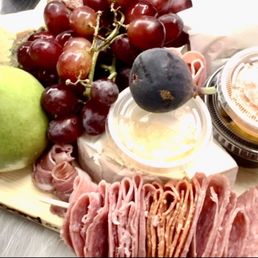 Charcuterie, grapes, honeycomb, chocolate, cheese Charcuterie, grapes, honeycomb, chocolate, cheese