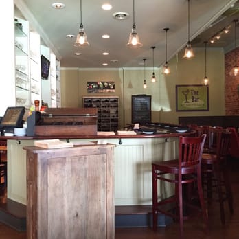 Grits Cafe - The hostess stand, bar behind. - Southern Near Me - Forsyth, Georgia