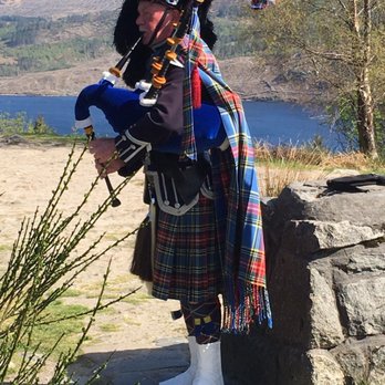 Rabbie's Tours - Lone bagpiper playing at one of our stops. - Tours Near Me - Edinburgh, EDH