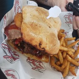 Smash burger with brisket and onion rings. Smash burger with brisket and onion rings.