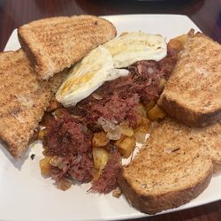 Corned beef hash with eggs over-hard and wheat toast. So, so good!