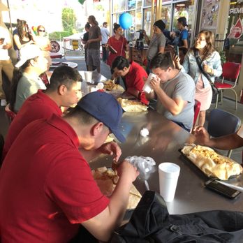 Taco Station - Participants trying to eat the Axle Burrito within 30 minutes.. - Mexican Near Me - Riverside, California Taco Station - Participants trying to eat the Axle Burrito within 30 minutes.. - Mexican Near Me - Riverside, California