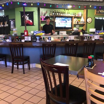 Sato Sushi - Bar area . Sushi chef sharpening his blade . - Japanese Near Me - Upland, California Sato Sushi - Bar area . Sushi chef sharpening his blade . - Japanese Near Me - Upland, California