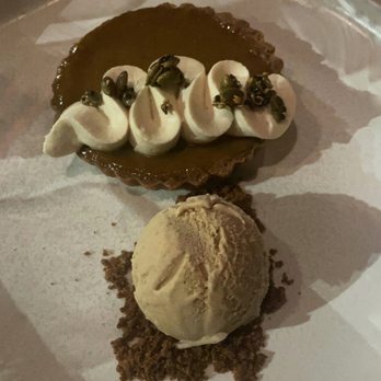 Ryla - Pumpkin pie topped w/ cream cheese frosting and pumpkin seeds. Chai tea cream. - Asian Fusion Near Me - Hermosa Beach, California Ryla - Pumpkin pie topped w/ cream cheese frosting and pumpkin seeds. Chai tea cream. - Asian Fusion Near Me - Hermosa Beach, California