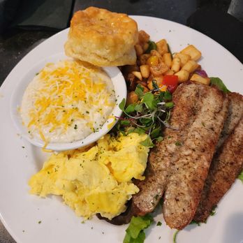 Katch Kitchen & Cocktails - Brunch, Chicken Sausage, Grits, Eggs, Potatoes, and a honey biscuit - Bars Near Me - Tucker, Georgia Katch Kitchen & Cocktails - Brunch, Chicken Sausage, Grits, Eggs, Potatoes, and a honey biscuit - Bars Near Me - Tucker, Georgia