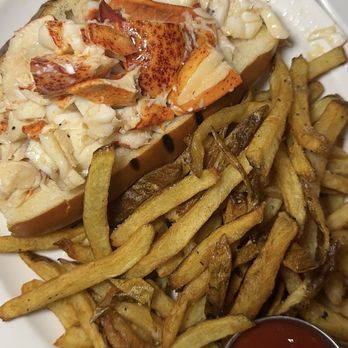 Neptune Oyster - Lobster roll! Wish it came with more toppings and the bun gets soggy so fast - Seafood Near Me - Boston, Massachusetts