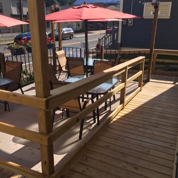 The Dinner Plate - a patio with tables and umbrellas - American Near Me - Stamford, New York The Dinner Plate - a patio with tables and umbrellas - American Near Me - Stamford, New York