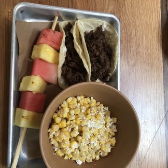 Bartaco - Corn off the cob, two kids beef tacos (less spicy than the sesame ribeye), and a fruit kabob - Mexican Near Me - Tampa, Florida Bartaco - Corn off the cob, two kids beef tacos (less spicy than the sesame ribeye), and a fruit kabob - Mexican Near Me - Tampa, Florida