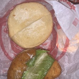 a chicken sandwich with lettuce on a bun a chicken sandwich with lettuce on a bun