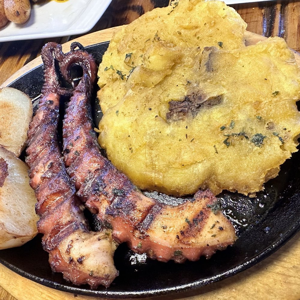 Ave Maria Gastro Lounge - Grilled octopus tentacles with potatoes and chimichurri sauce. - Lounges Near Me - Casselberry, Florida Ave Maria Gastro Lounge - Grilled octopus tentacles with potatoes and chimichurri sauce. - Lounges Near Me - Casselberry, Florida