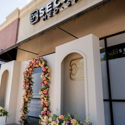 It’s a Secret Med Spa - front of med spa with event set up