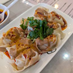Red oil ravioli with house special red oil and sesame sauce. (12.99 on jun 19, 2026) Red oil ravioli with house special red oil and sesame sauce. (12.99 on jun 19, 2026)