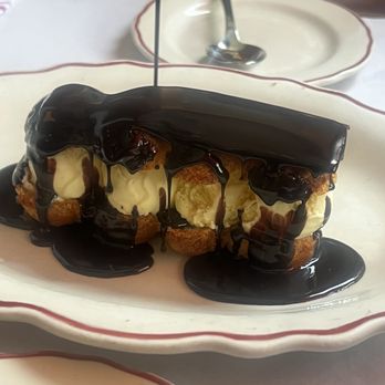 Le Diplomate - Profiteroles: praline, banana, vanilla ice cream, bittersweet chocolate. I want to eat this every day. :) - Brasseries Near Me - Washington, DC, District of Columbia
