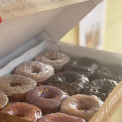 Baloo's Donuts & Coffee - Dozen donuts, spring floral flavors on left