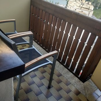Hotel Steffani - balcony chairs with view of lake in far background - Hotels Near Me - Sankt Moritz, GR