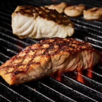 Bonefish Grill - a piece of salmon being cooked on a grill - Seafood Near Me - Mccandless, Pennsylvania Bonefish Grill - a piece of salmon being cooked on a grill - Seafood Near Me - Mccandless, Pennsylvania