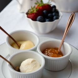 DOJA Tea Lounge - Homemade clotted cream, peach jam, and lemon curd.