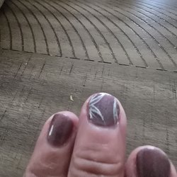 Nails By Michael - This is the awful look of a manicure...and he cut my ling nails off and was trying to sell me on acrylic nails!