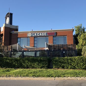 La Cage - he front of a building with a clock tower - Sports Bars Near Me - Saint-Laurent, Quebec La Cage - he front of a building with a clock tower - Sports Bars Near Me - Saint-Laurent, Quebec