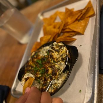 One Door North - Hot spinach dip... subbed the bread for homemade tortilla chips. - New American Near Me - San Diego, California One Door North - Hot spinach dip... subbed the bread for homemade tortilla chips. - New American Near Me - San Diego, California