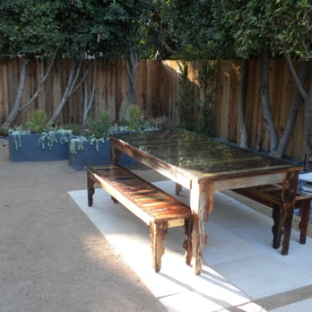 GLD Landscape Design - a table and bench in a backyard - Landscaping Near Me