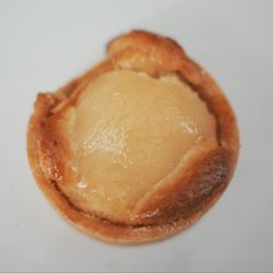 Savour Bakery - Pear Danish. A golden, flaky pastry with a pear half in the center. Sweet and refreshing.