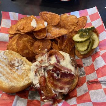 Monk's Bar & Grill - Black & Bleu burger with chips. "Beer batter" fries in background. - Sports Bars Near Me - Eau Claire, Wisconsin Monk's Bar & Grill - Black & Bleu burger with chips. "Beer batter" fries in background. - Sports Bars Near Me - Eau Claire, Wisconsin