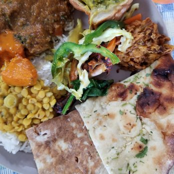 Himalayan Curry House - The plate of food with Naan on the bottom side - Himalayan/Nepalese Near Me - Oakland, California