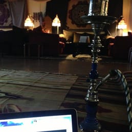 a hookah lounge with a laptop a hookah lounge with a laptop