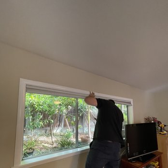 Tilma Building Solutions  - a man looking out a window - Flooring Near Me - Menlo Park, California