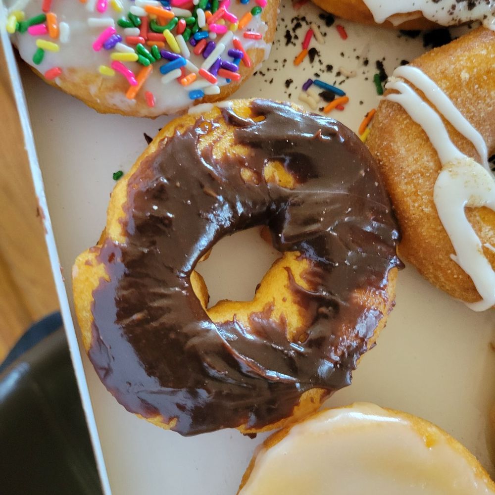 Sloppy glazed chocolate donut