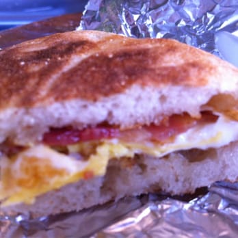Small World Coffee - Pile driver- fried egg, bacon, garlic butter, aged cheddar on an English muffin - Coffee & Tea Near Me - Princeton, New Jersey