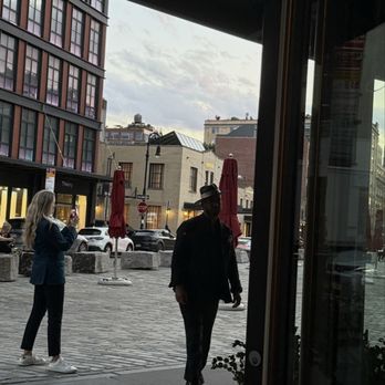 Sirrah - The open doors onto Gansevoort Street - French Near Me - New York, New York Sirrah - The open doors onto Gansevoort Street - French Near Me - New York, New York