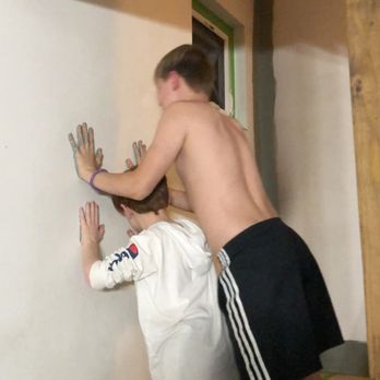 Uso Construction - a man and a woman climbing up the stairs - General Contractors Near Me Uso Construction - a man and a woman climbing up the stairs - General Contractors Near Me