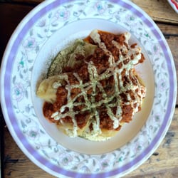 Kutchi Deli Parwana - Steamed Carrot Dumplings with lamb sauce