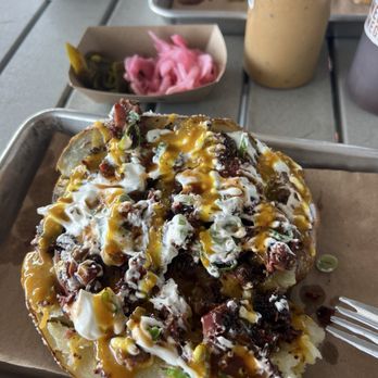 Feges BBQ - Loaded bbq potato with brisket AND THE MUSTARD SAUCE - Barbeque Near Me - Houston, Texas