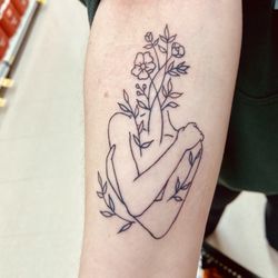 Gold Standard Tattoo - Inner forearm, floral lady tattoo, black ink