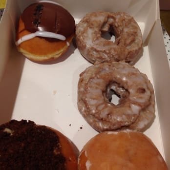 Krispy Kreme - Fall themed doughnuts! Pumpkin spice, kreme filled footballs, and regular jelly filled. Fattening but great. - Donuts Near Me - Cayce, South Carolina