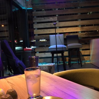 Moku Kitchen - Front and center near the stage, there's live music daily - Cocktail Bars Near Me - Honolulu, Hawaii
