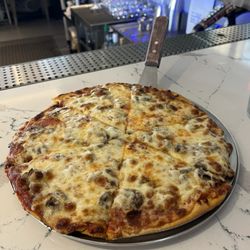 Durbins - Small, thin crust pepperoni and mushroom pizza. Crispy and piping hot.