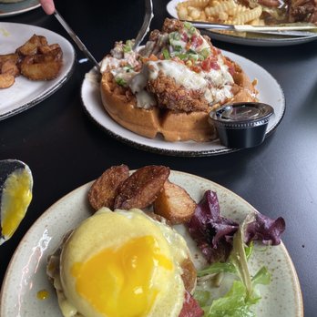 Rosebud Bar & Kitchen - Porto Benny (eggs Benedict), Chicken and Waffles, and the Crispy Chicken Ranch BLT (back right). - New American Near Me - Somerville, Massachusetts Rosebud Bar & Kitchen - Porto Benny (eggs Benedict), Chicken and Waffles, and the Crispy Chicken Ranch BLT (back right). - New American Near Me - Somerville, Massachusetts